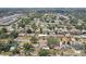 Elevated view of homes among trees, some featuring pools, in an established residential community at 1450 Seabreeze St, Clearwater, FL 33756