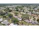 Neighborhood homes seen from above, showcasing properties with fenced yards and established greenery at 1450 Seabreeze St, Clearwater, FL 33756