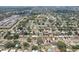 Community aerial view, featuring houses with backyard pools and proximity to local amenities at 1450 Seabreeze St, Clearwater, FL 33756