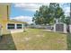 The home has a large backyard with a small deck, large shed and fire pit area at 1450 Seabreeze St, Clearwater, FL 33756