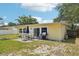 This home has a large backyard that features a brick patio and outdoor seating area at 1450 Seabreeze St, Clearwater, FL 33756