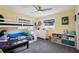 bedroom featuring a bunk bed, ceiling fan, and large window at 1450 Seabreeze St, Clearwater, FL 33756
