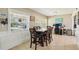 Open dining room features a large window, and tile flooring at 1450 Seabreeze St, Clearwater, FL 33756