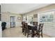 Bright dining area with natural light, wainscoting and views of the front yard at 1450 Seabreeze St, Clearwater, FL 33756