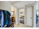 Hallway connecting to a bathroom and bedroom; includes tile flooring and neutral paint at 1450 Seabreeze St, Clearwater, FL 33756