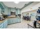 Charming kitchen features custom cabinets, granite counters and stainless steel appliances at 1450 Seabreeze St, Clearwater, FL 33756