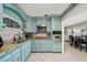 Kitchen with custom blue cabinetry and granite countertops at 1450 Seabreeze St, Clearwater, FL 33756