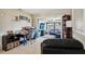 Open concept home office that views into the living room and boasts built in shelves and natural lighting at 1450 Seabreeze St, Clearwater, FL 33756