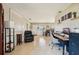 Open-concept living space with a dining area, desk, and comfortable seating at 1450 Seabreeze St, Clearwater, FL 33756