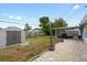 Spacious backyard with shed, covered patio, and gravel area at 1489 77Th N Ave, St Petersburg, FL 33702