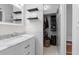 Updated bathroom with marble vanity, ample storage and a closet at 1489 77Th N Ave, St Petersburg, FL 33702