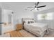 Bright bedroom with a ceiling fan, natural light and an ensuite bathroom at 1489 77Th N Ave, St Petersburg, FL 33702