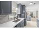 Bright and airy kitchen showcases updated cabinets, quartz countertops, and stainless appliances at 1489 77Th N Ave, St Petersburg, FL 33702