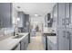 Beautiful renovated kitchen featuring stainless steel appliances and gray cabinets at 1489 77Th N Ave, St Petersburg, FL 33702