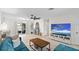 Bright and airy living room featuring modern decor, a comfortable blue sofa, and sliding doors to the backyard at 1489 77Th N Ave, St Petersburg, FL 33702
