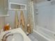 Cozy bathroom with tub/shower combo, white tile, and neutral-toned walls at 1515 Park N St, St Petersburg, FL 33710