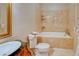 Elegant bathroom with marble-tiled walls, a soaking tub, and decorative vanity at 1515 Park N St, St Petersburg, FL 33710