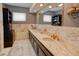 Bathroom with marble counters and unique faucets, plus lots of shelving for storage and display at 1515 Park N St, St Petersburg, FL 33710
