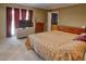 Bedroom featuring a queen size bed, two windows, two dressers, and neutral toned walls at 1515 Park N St, St Petersburg, FL 33710