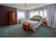 Large bedroom with sitting area, large windows, and antique furniture at 1515 Park N St, St Petersburg, FL 33710