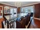 Elegant dining room featuring a glass-top table, designer chairs and luxury details at 1515 Park N St, St Petersburg, FL 33710