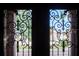 Ornate metal work on a glass doorway provides an elegant access to the property at 1515 Park N St, St Petersburg, FL 33710
