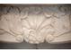 Close-up showcasing the intricate carvings on the marble fireplace mantel at 1515 Park N St, St Petersburg, FL 33710