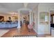 Grand foyer with tile floors, decorative columns, chandelier, and views into the living room at 1515 Park N St, St Petersburg, FL 33710