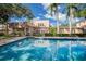 Backyard pool reflecting the home's elegant architecture, surrounded by lush landscaping for a serene outdoor experience at 1515 Park N St, St Petersburg, FL 33710