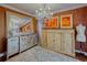 Tastefully decorated room, with chandelier lighting, large mirror, matching art and storage cabinets at 1515 Park N St, St Petersburg, FL 33710
