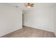Bright bedroom with wood-look floors, and a door to the ensuite at 1613 Comfy Ct, Sun City Center, FL 33573