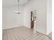 Bright dining room with tile flooring and a classic chandelier at 1613 Comfy Ct, Sun City Center, FL 33573