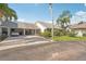 Charming home with a covered carport and a well-manicured lawn at 1613 Comfy Ct, Sun City Center, FL 33573