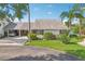 Beautiful single-story home with a double carport, well-maintained lawn, and attractive curb appeal at 1613 Comfy Ct, Sun City Center, FL 33573