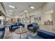 Spacious lobby featuring tile floors, comfortable couches, accent chairs, and elegant lighting fixtures at 1613 Comfy Ct, Sun City Center, FL 33573