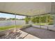 Screened patio overlooking a picturesque lake view at 1613 Comfy Ct, Sun City Center, FL 33573