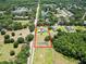 Aerial view showing the 1.4 acre lot, surrounding neighborhood, and the property's layout at 16220 Lake Armistead Way, Odessa, FL 33556