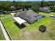 Aerial view of property and backyard featuring a pool, detached covered storage, and storage shed at 16220 Lake Armistead Way, Odessa, FL 33556