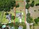 Aerial view of the property showcasing the expansive lot, pool area, and surrounding landscape at 16220 Lake Armistead Way, Odessa, FL 33556