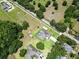 Aerial view highlighting a well-maintained home, sparkling pool, and surrounding green acreage at 16220 Lake Armistead Way, Odessa, FL 33556