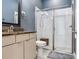 Bathroom featuring granite countertops and a tiled walk-in shower at 16220 Lake Armistead Way, Odessa, FL 33556