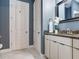 Bathroom featuring granite countertop vanity, framed mirror, and white flower accent at 16220 Lake Armistead Way, Odessa, FL 33556