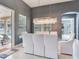 Bright dining room featuring a glass table, white chairs, and modern chandelier lighting at 16220 Lake Armistead Way, Odessa, FL 33556