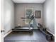Workout room featuring a treadmill, rowing machine, and a window for natural light at 16220 Lake Armistead Way, Odessa, FL 33556