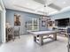 Game room featuring a pool table, Harley Davidson light fixture, and coffered ceiling at 16220 Lake Armistead Way, Odessa, FL 33556