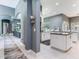 Open floor plan leading to the kitchen with granite countertops and stainless steel appliances and into Gathering room at 16220 Lake Armistead Way, Odessa, FL 33556