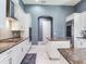 Gourmet kitchen with white cabinets, stainless steel appliances, granite counters, and dual kitchen islands at 16220 Lake Armistead Way, Odessa, FL 33556