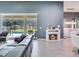 Living room featuring sliding glass doors, a fireplace, and access to the dining area at 16220 Lake Armistead Way, Odessa, FL 33556