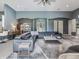 Spacious living room with a large gray sectional sofa and stylish rug at 16220 Lake Armistead Way, Odessa, FL 33556
