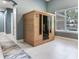 Infrared sauna in the home gym with tiled floors and natural lighting at 16220 Lake Armistead Way, Odessa, FL 33556